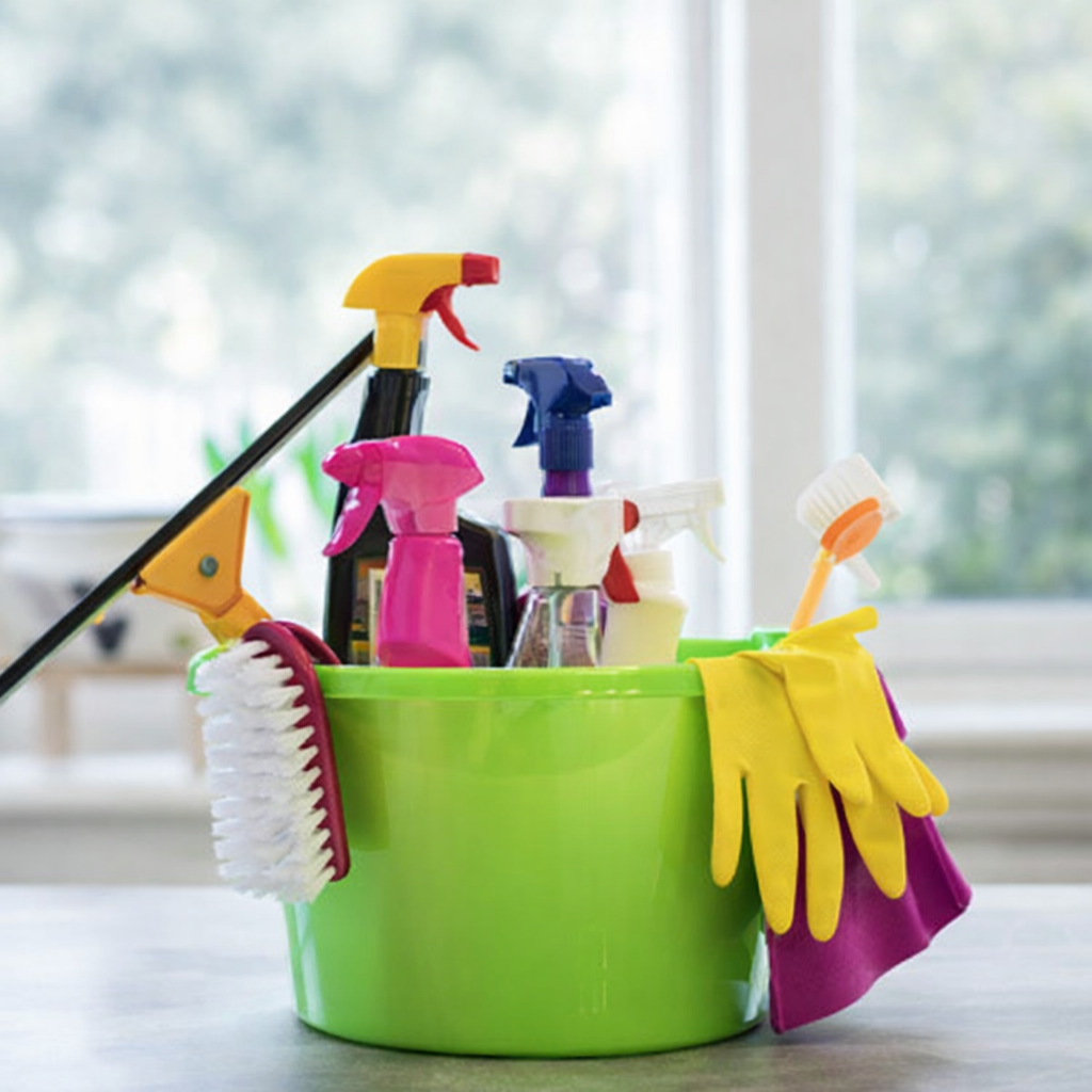 Cleaning Supplies In A Green Bucket