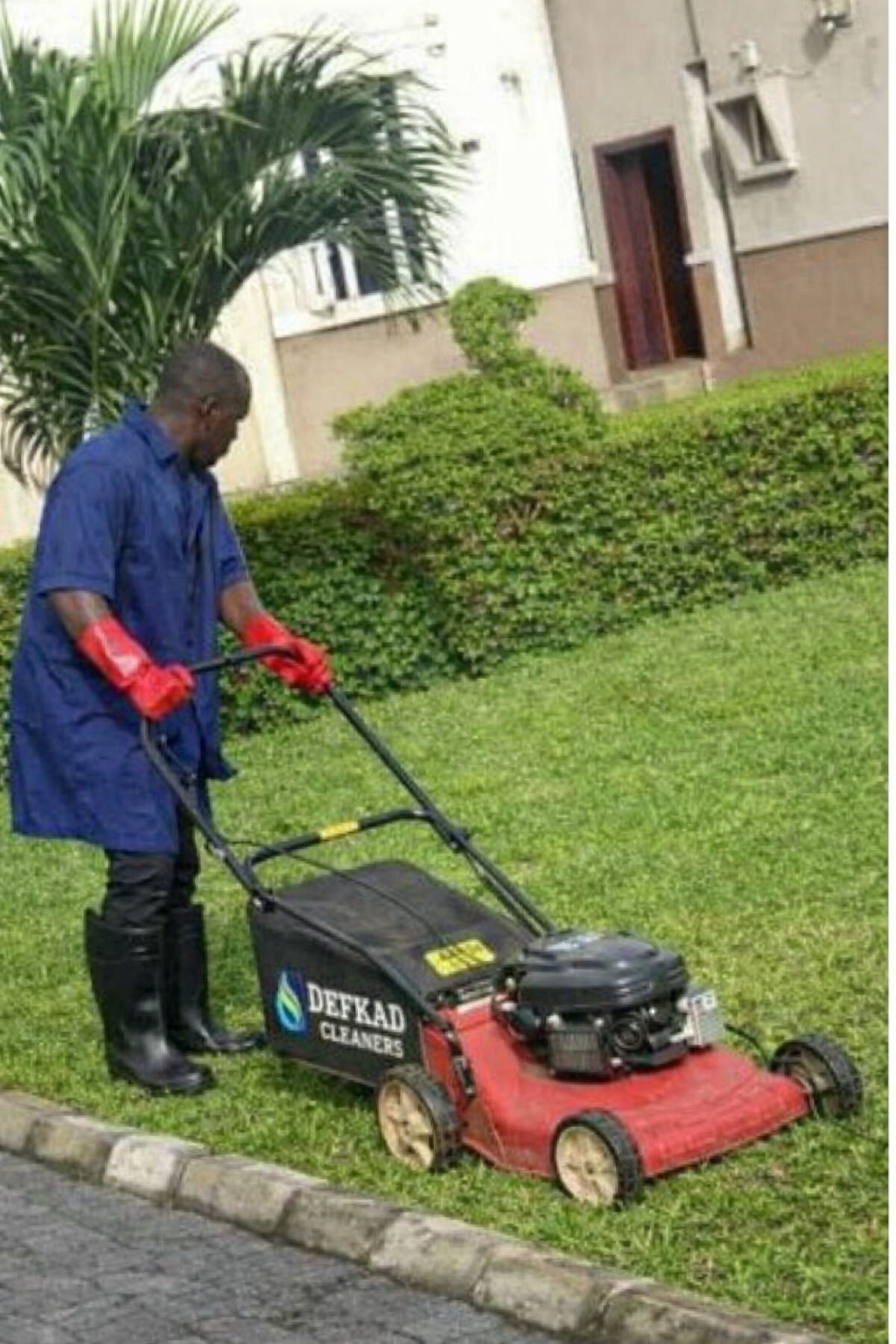 Lawn Maintenance Worker Using A Mower